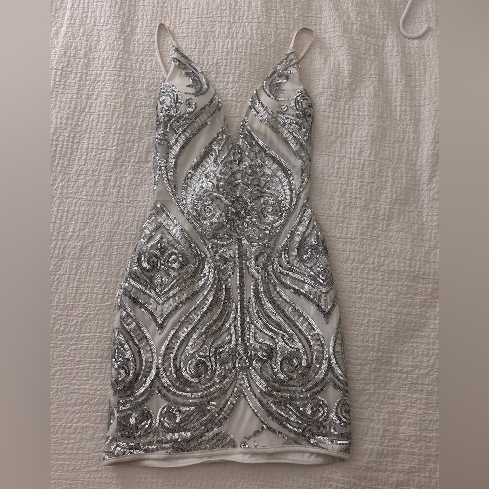 Windsor size Medium, tight fitting mini dress.